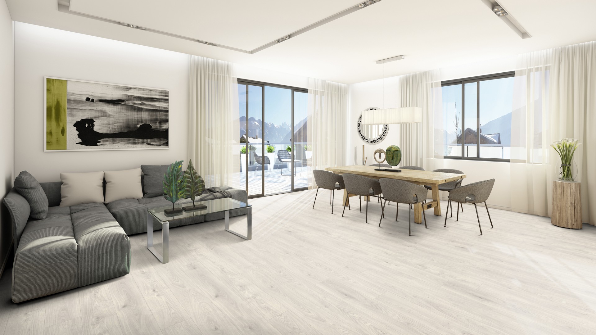 Ein großer offener Wohn-Essbereich mit einem hellen Laminatboden in Holznachbildung und Blick in die Berge 